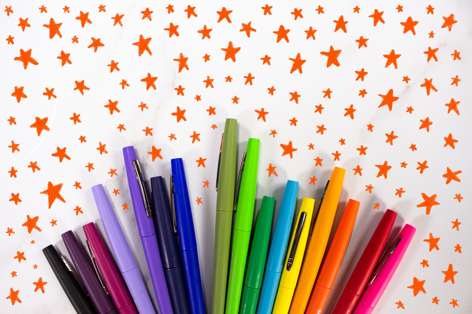 Colorful Rainbow Pens with stars around them