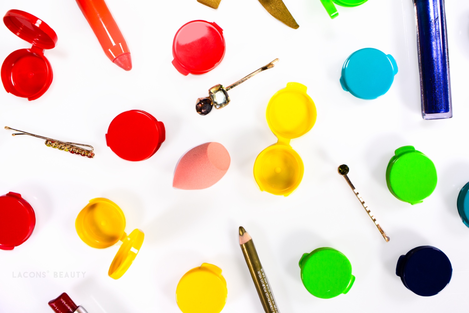 An assortment of colorful Lacons beauty hinged containers and beauty products